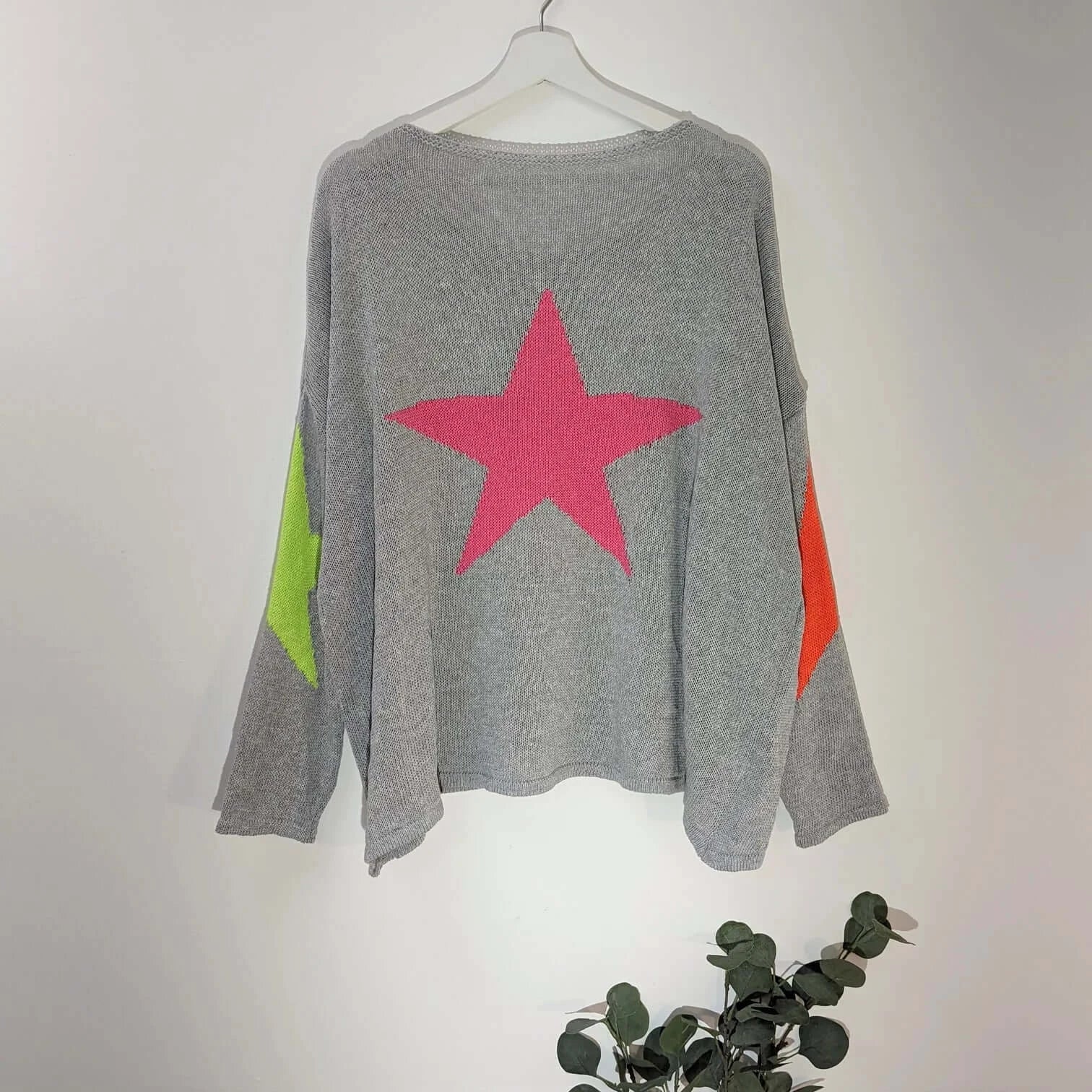 Slight hi-lo jumper with bright stars on back and elbows