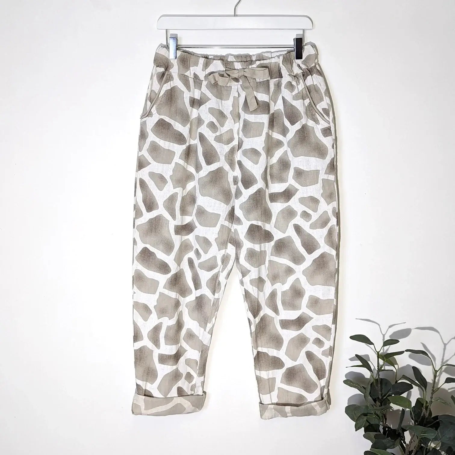 Jogger style linen trousers in giraffe print
