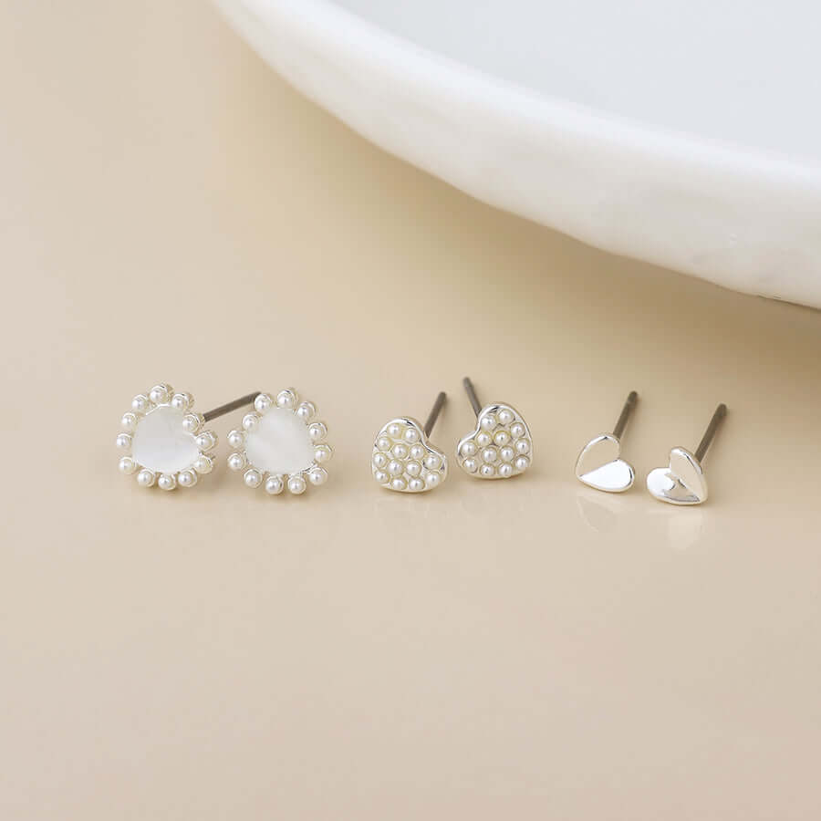 POM925 - Silver plated triple heart and pearl stud earring set