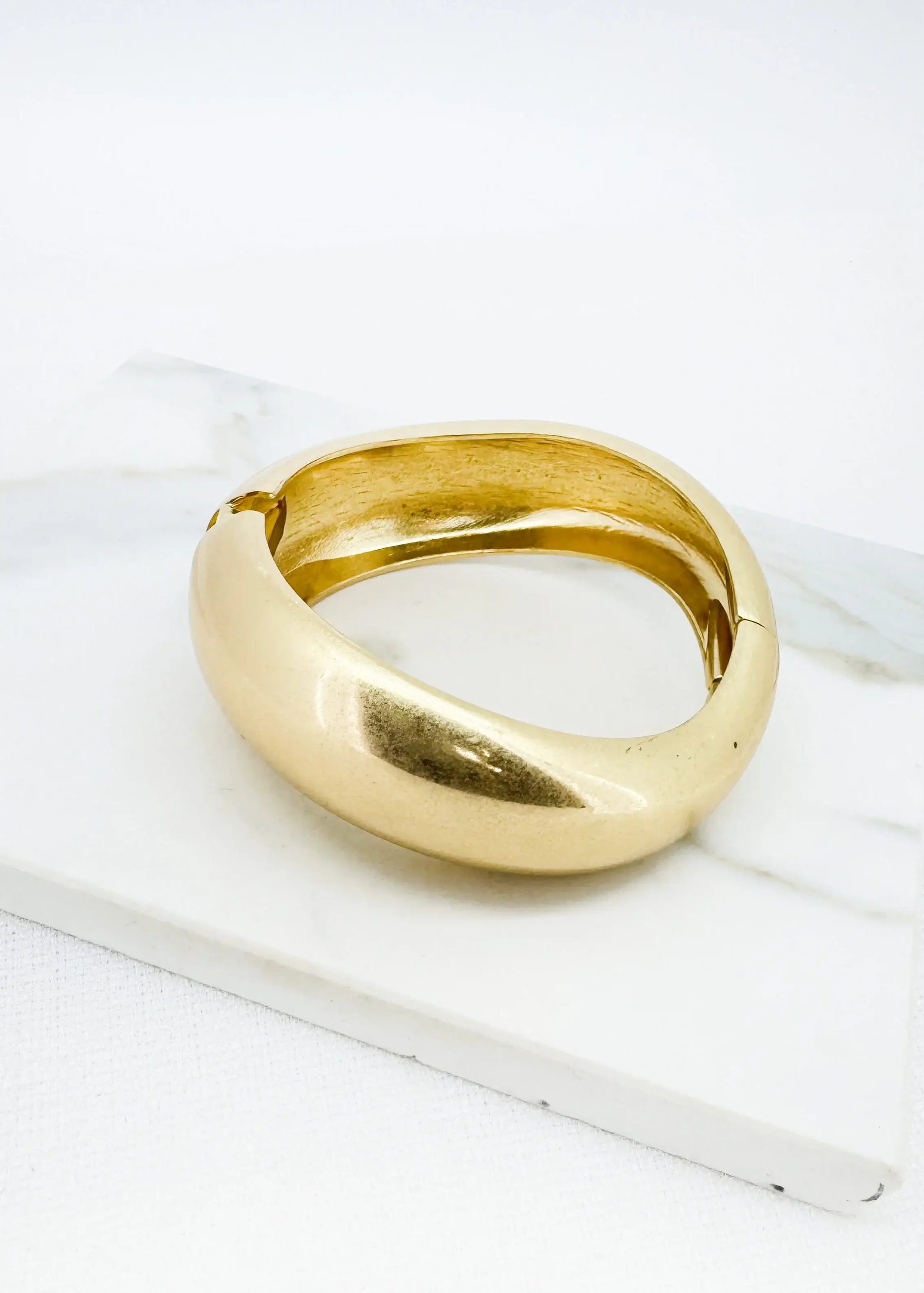 Envy Jewellery - Worn gold wide hinged bangle