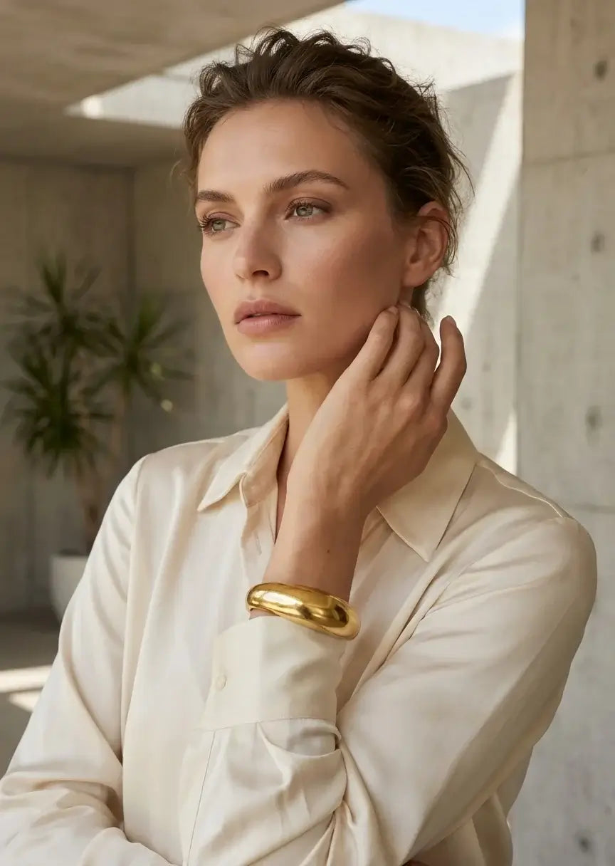 Envy Jewellery - Worn gold wide hinged bangle