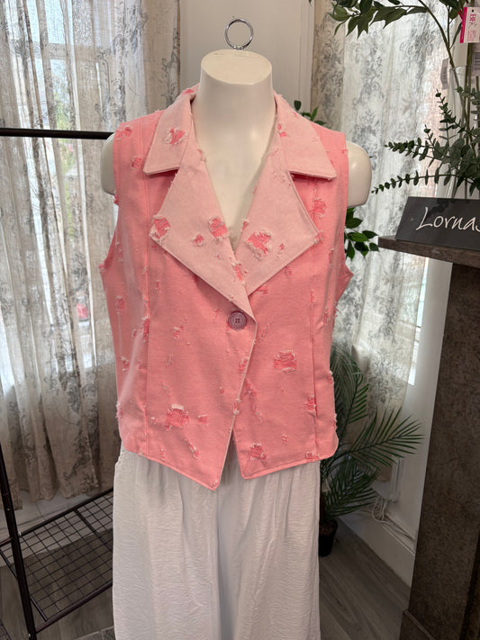A pink sleeveless vest with a textured, distressed fabric and subtle floral embroidery, displayed on a white mannequin torso. The vest features a notched lapel collar and a single button closure.