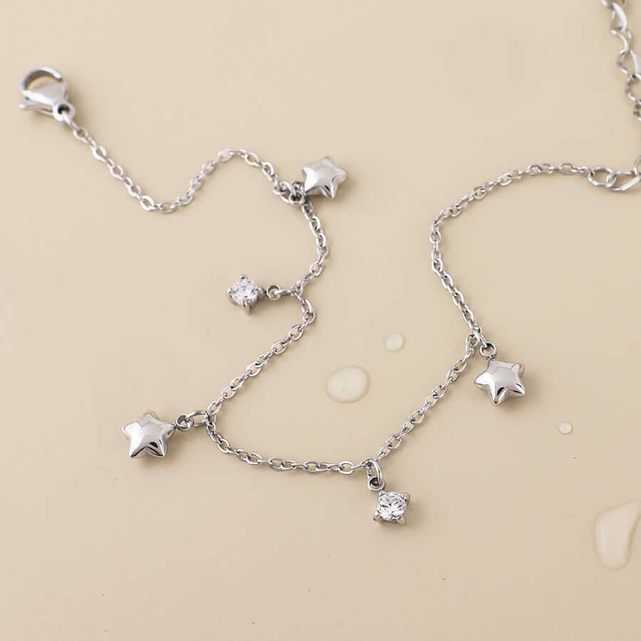 POM925 - Contstance stainless steel platinum plated stars and crystals station bracelet