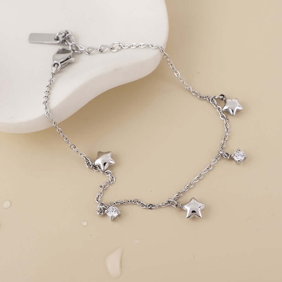 POM925 - Contstance stainless steel platinum plated stars and crystals station bracelet