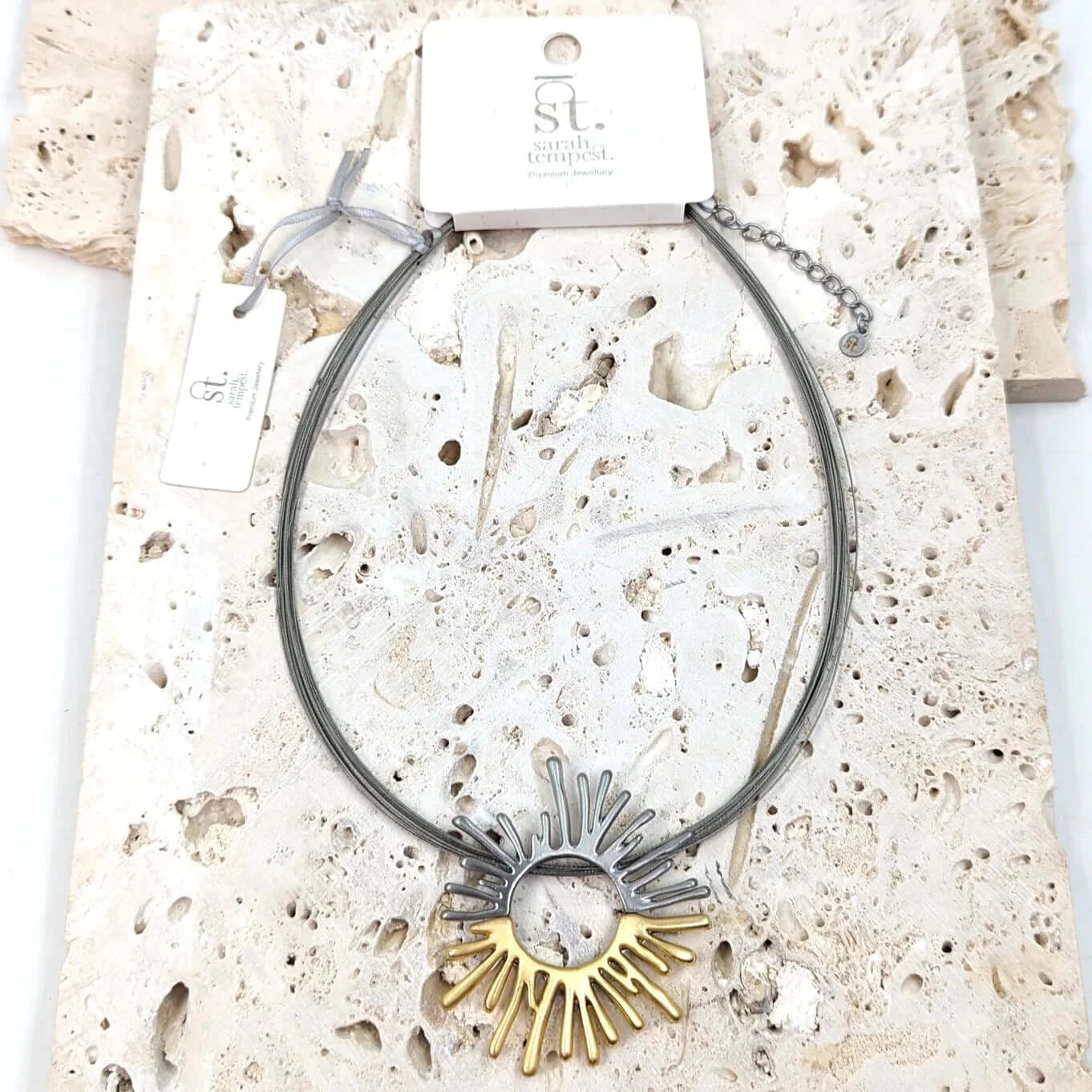 Stylish sun burst motif on multi-wire necklace